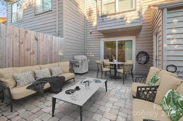 a outdoor space with patio the couches and a potted plant on a table