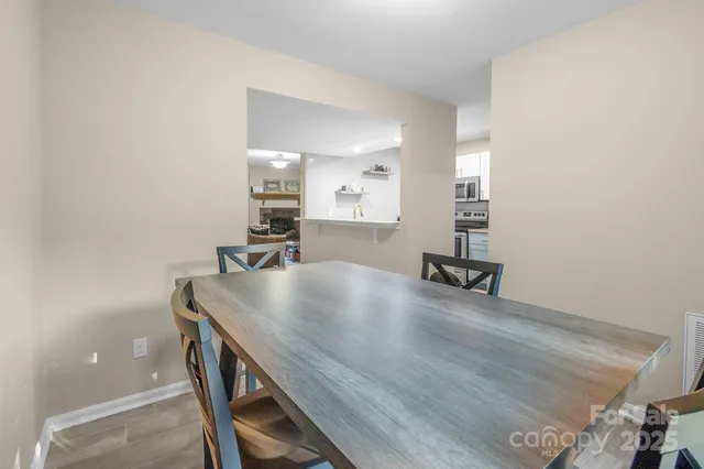 a room with a table and chairs