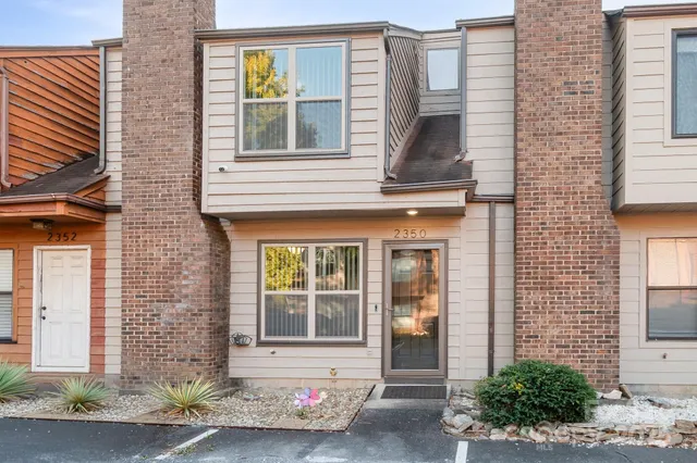 a front view of a house with a garage
