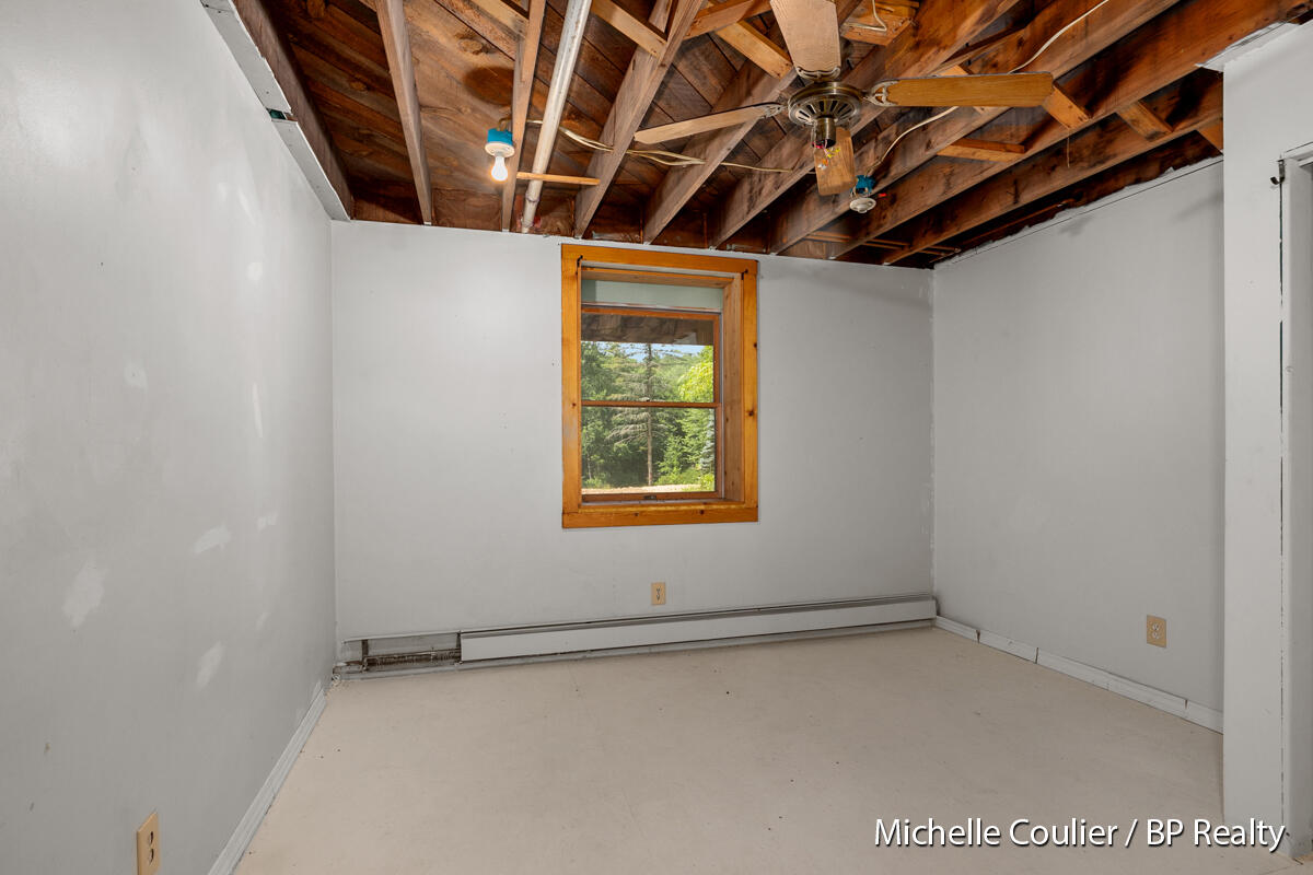 1147 Stakes Road Gowen, MI 49326 - Photo 49 of 105 partially finished bedroom in basement