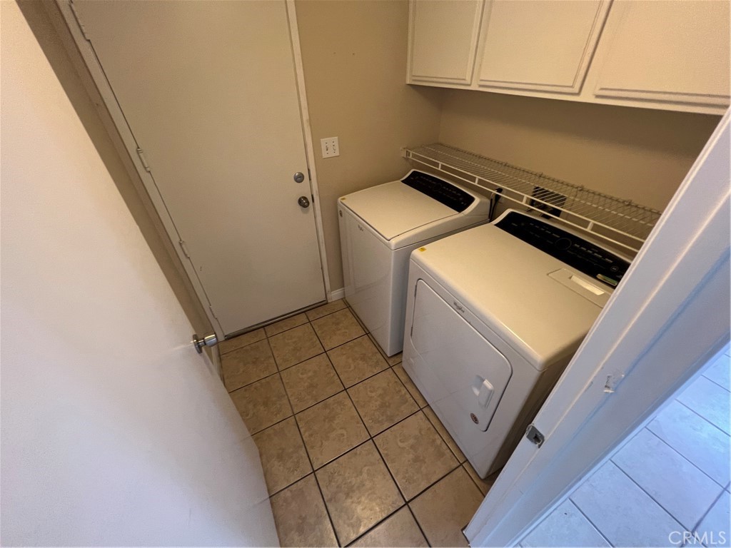 31264 Nice Avenue Mentone, CA 92359 - Photo 11 of 28 a utility room with dryer and washer
