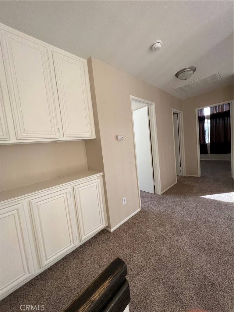 31264 Nice Avenue Mentone, CA 92359 - Photo 13 of 28 a view of a kitchen with cabinets