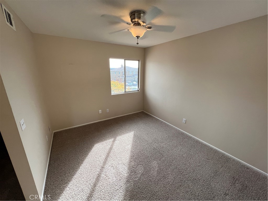 31264 Nice Avenue Mentone, CA 92359 - Photo 17 of 28 wooden floor in an empty room with a window