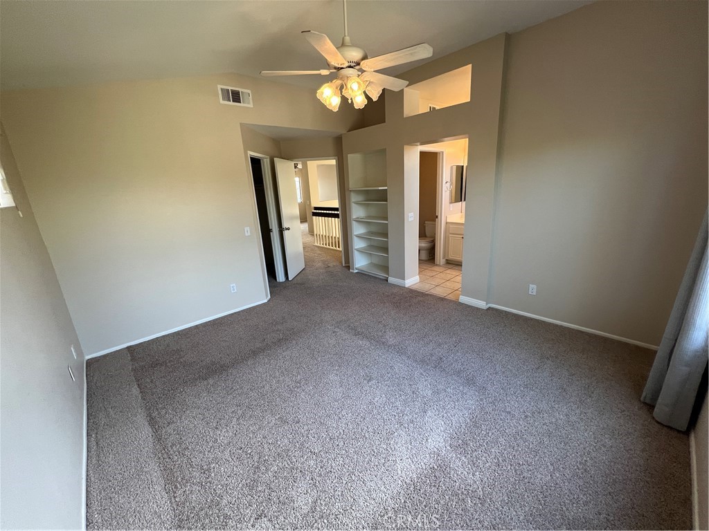 31264 Nice Avenue Mentone, CA 92359 - Photo 18 of 28 a view of a big room with chandelier fan and windows
