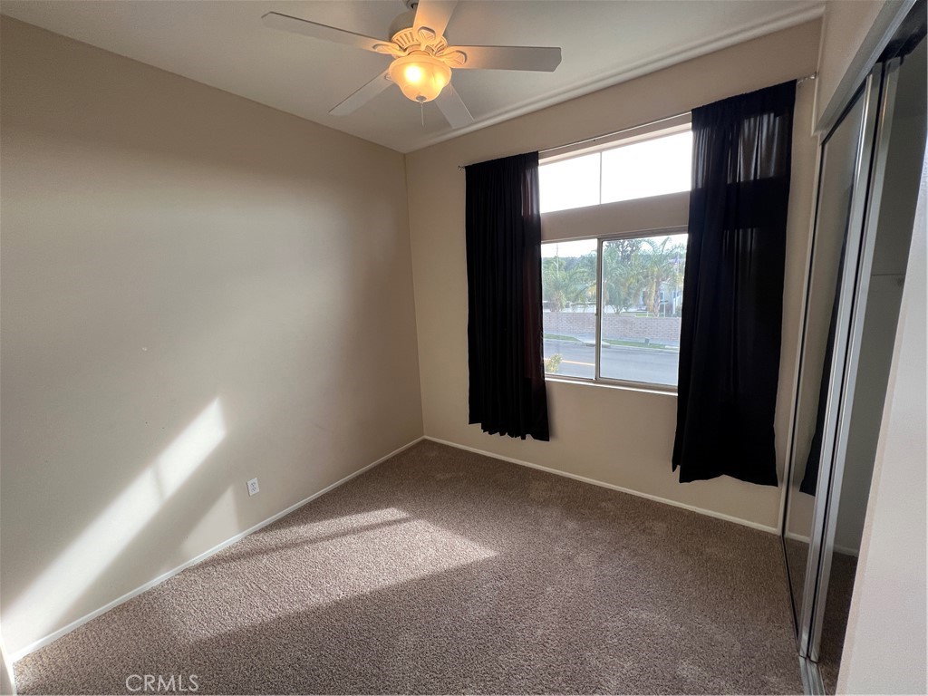 31264 Nice Avenue Mentone, CA 92359 - Photo 21 of 28 an empty room with windows and entrance