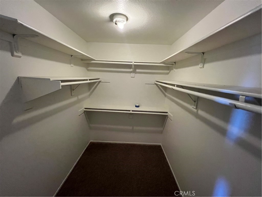 31264 Nice Avenue Mentone, CA 92359 - Photo 24 of 28 a view of storage and utility room with racks on the wall