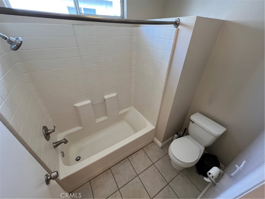 31264 Nice Avenue Mentone, CA 92359 - Photo 25 of 28 a bathroom with a toilet and a sink
