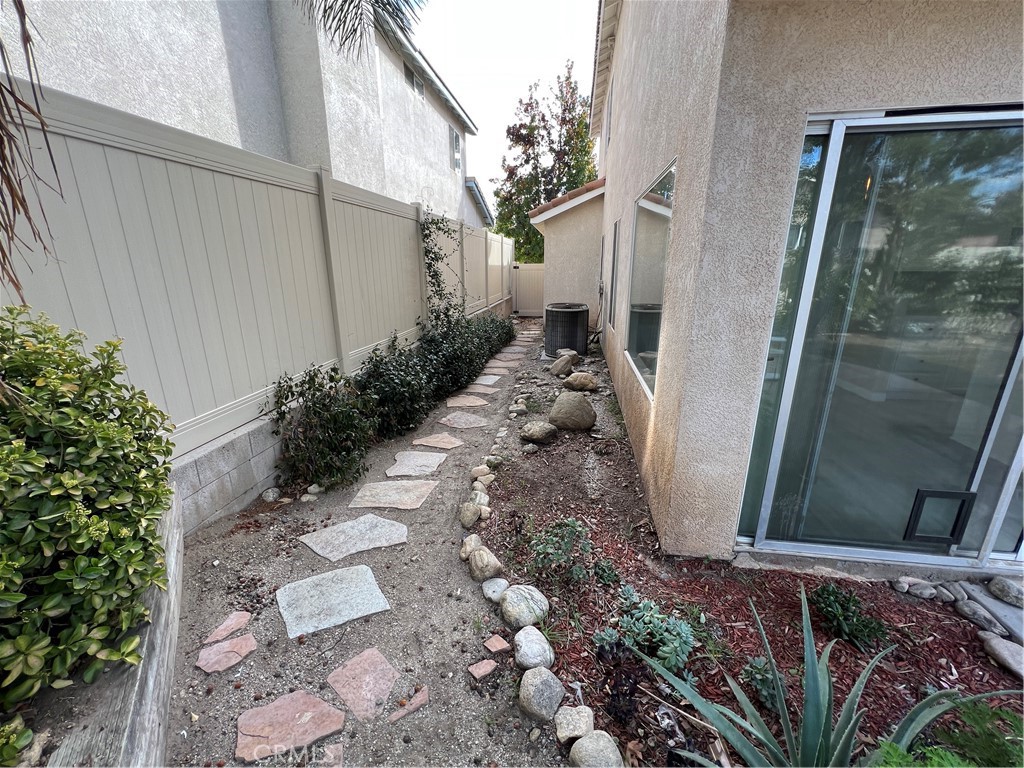 31264 Nice Avenue Mentone, CA 92359 - Photo 26 of 28 a view of a pathway of a house with a backyard