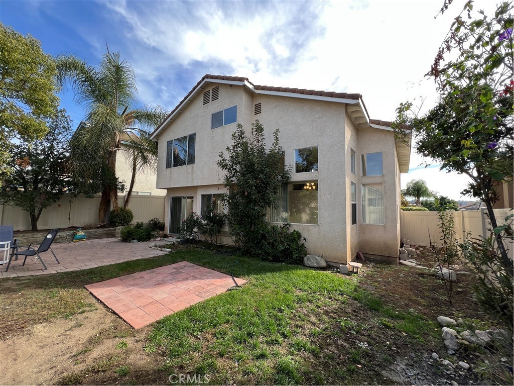31264 Nice Avenue Mentone, CA 92359 - Photo 27 of 28 a front view of a house with yard and garage