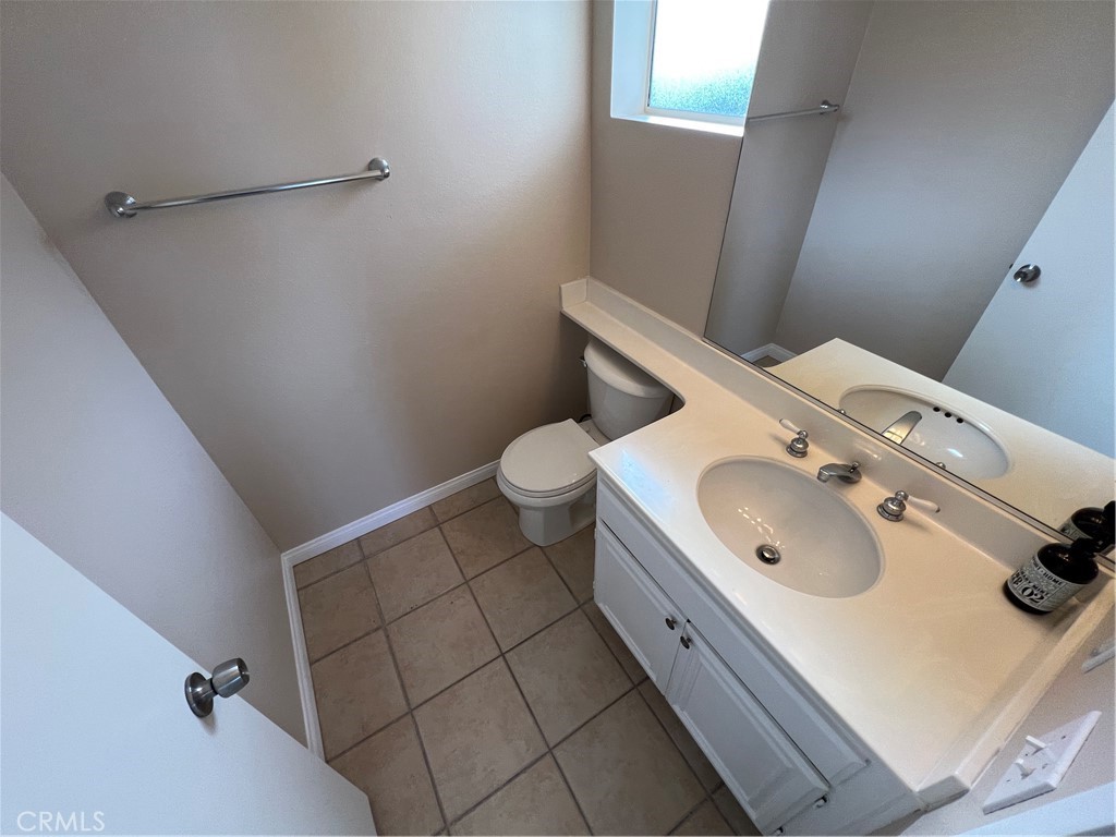 31264 Nice Avenue Mentone, CA 92359 - Photo 10 of 28 a bathroom with a sink and toilet
