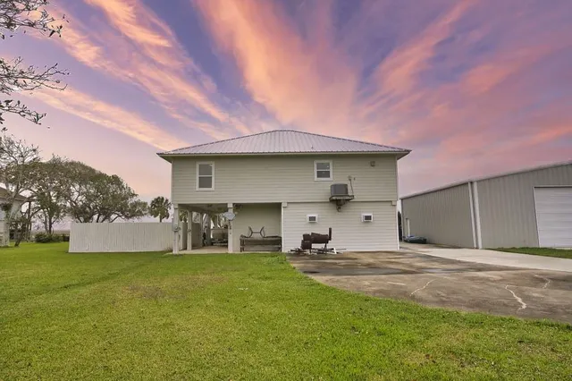 a house view with a sitting space and garden view