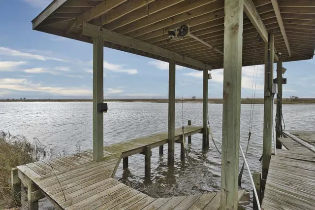 a view of a balcony with lake view and a floor to ceiling window