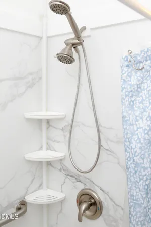 a bedroom with a bed and a potted plant