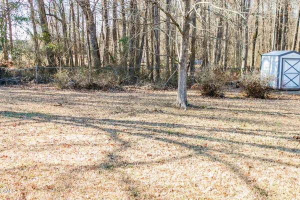 a view of a backyard of the house