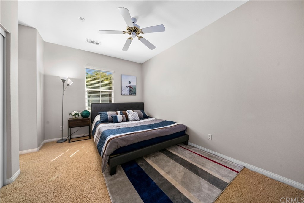 47 Walbert Lane Ladera Ranch, CA 92694 - Photo 16 of 25 a bedroom with a bed and a chandelier