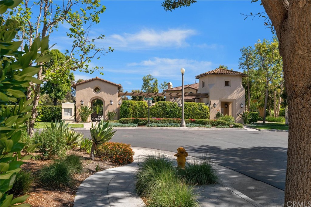 47 Walbert Lane Ladera Ranch, CA 92694 - Photo 22 of 25 a white house with a yard and a wooden fence