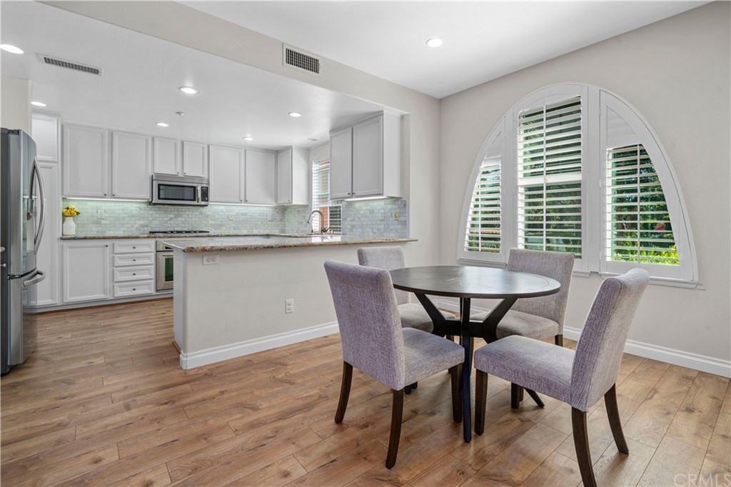 47 Walbert Lane Ladera Ranch, CA 92694 - Photo 3 of 25 a view of a dining room with furniture and wooden floor