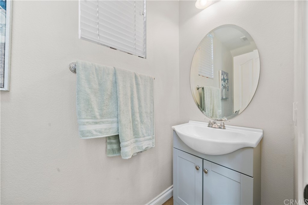 47 Walbert Lane Ladera Ranch, CA 92694 - Photo 9 of 25 a bathroom with a sink vanity and a mirror