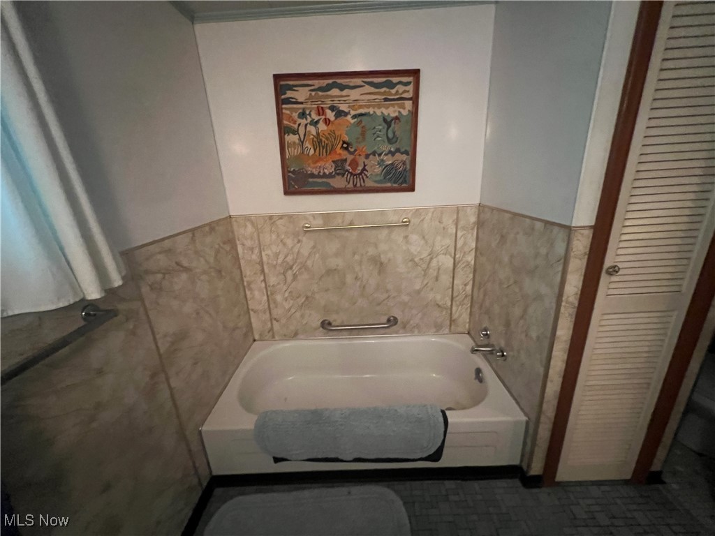 86610 Beaver Dam Road Scio, OH 43988 - Photo 30 of 50 Bathroom with tile walls and a tub to relax in