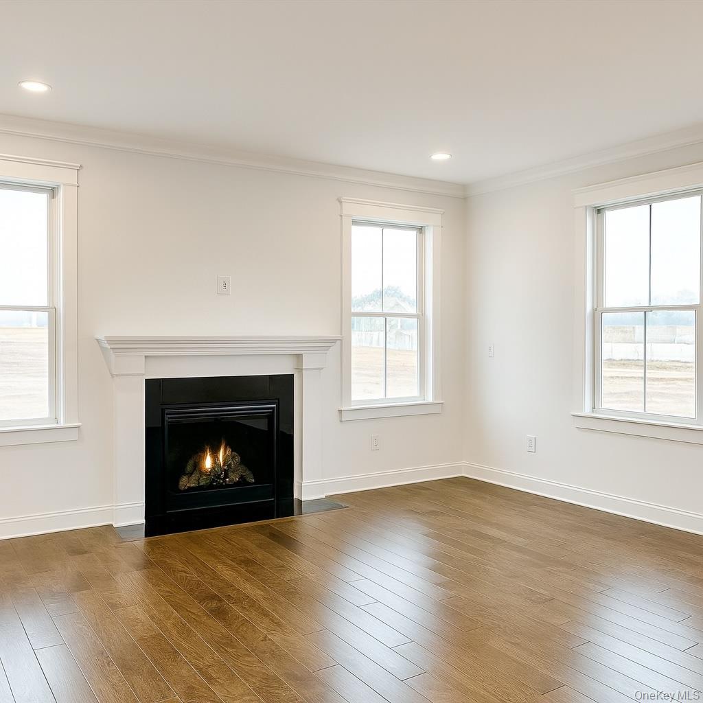 Lot 23 Frans Way Rocky Point, NY 11778 - Photo 7 of 8 an empty room with windows and a fireplace