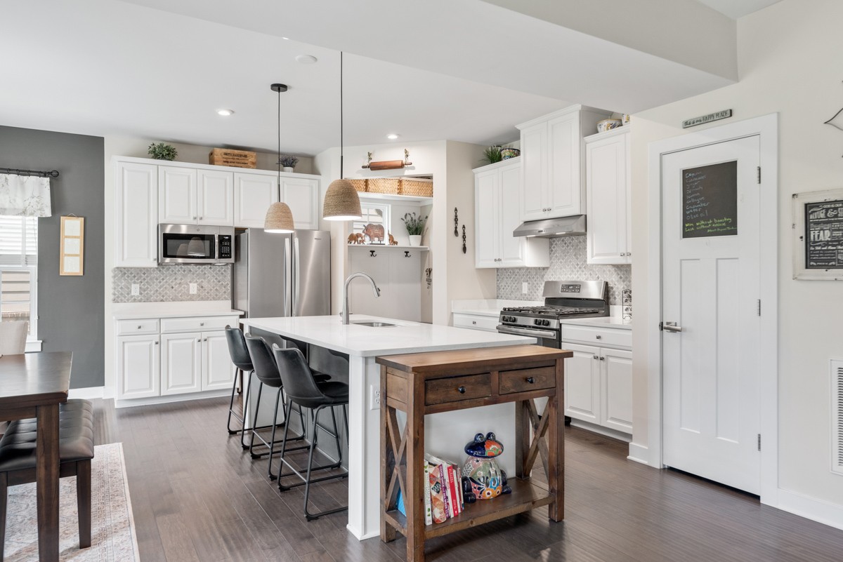 311 Collier Road Mount Juliet, TN 37122 - Photo 11 of 40 a kitchen with stainless steel appliances granite countertop a table chairs stove and refrigerator