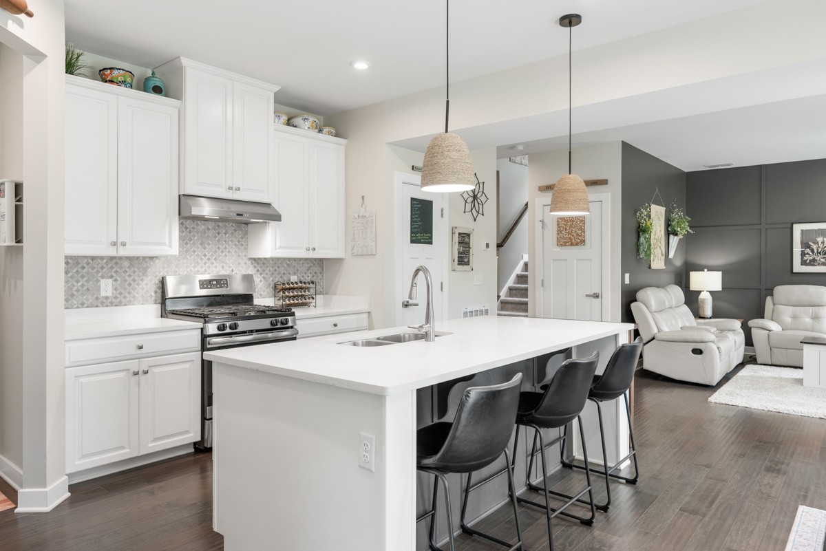 311 Collier Road Mount Juliet, TN 37122 - Photo 13 of 40 a kitchen with a stove a sink a dining table and chairs