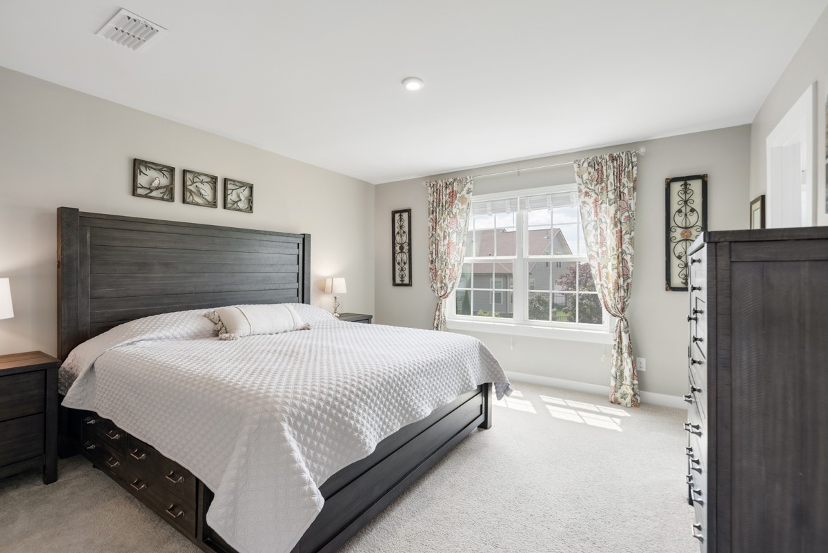 311 Collier Road Mount Juliet, TN 37122 - Photo 19 of 40 a bedroom with a large bed and a large window