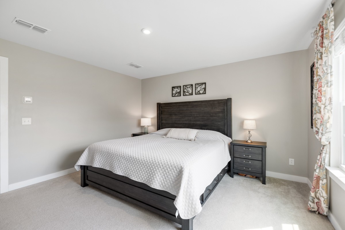 311 Collier Road Mount Juliet, TN 37122 - Photo 20 of 40 a bedroom with a bed and lamp