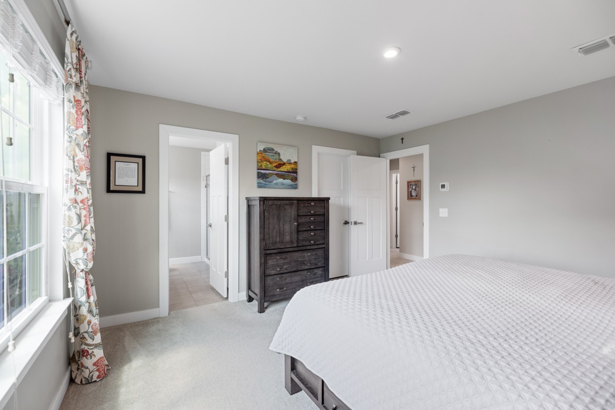 311 Collier Road Mount Juliet, TN 37122 - Photo 21 of 40 a bedroom with a bed and a walk in closet