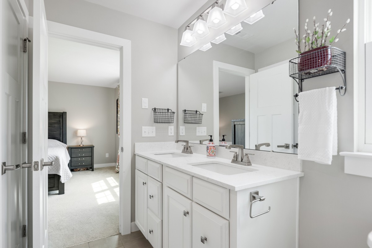 311 Collier Road Mount Juliet, TN 37122 - Photo 23 of 40 a spacious en suite bathroom with a sink double vanity and a mirror