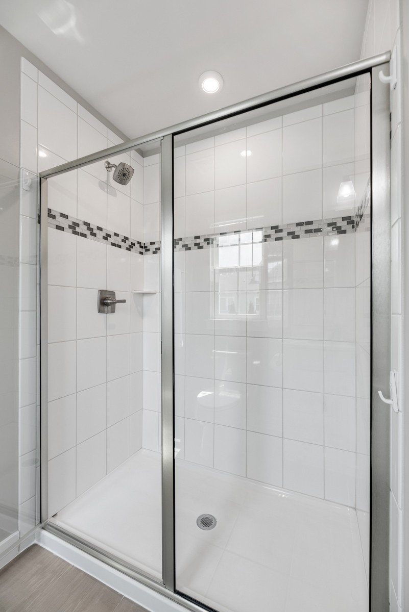 311 Collier Road Mount Juliet, TN 37122 - Photo 24 of 40 a bathroom with a shower and a glass door