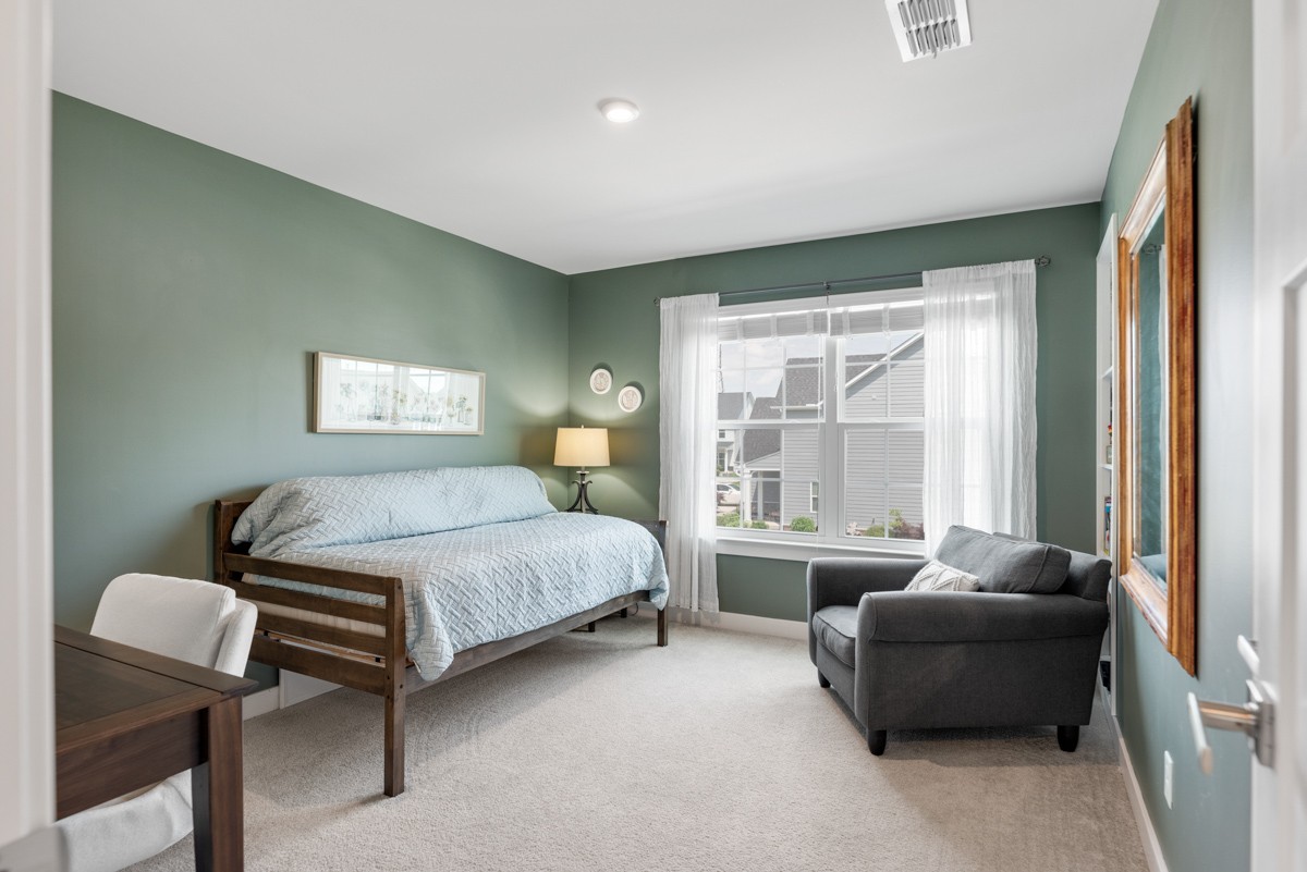 311 Collier Road Mount Juliet, TN 37122 - Photo 25 of 40 a bedroom with a bed and a couch next to a window