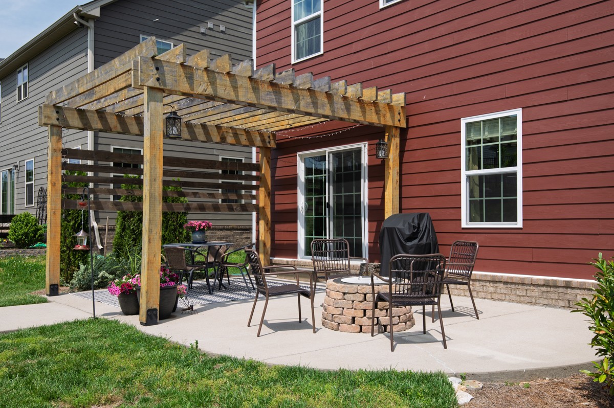 311 Collier Road Mount Juliet, TN 37122 - Photo 33 of 40 a view of a house with a patio and a garden