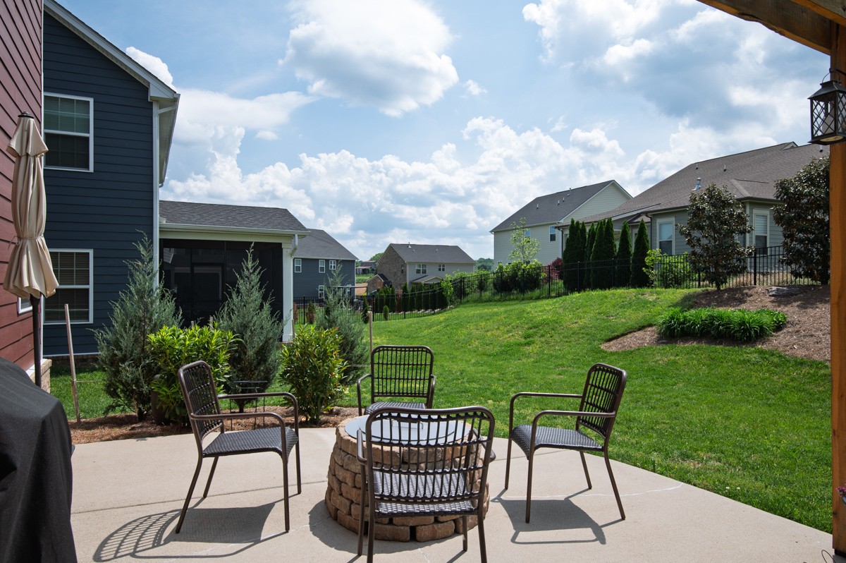 311 Collier Road Mount Juliet, TN 37122 - Photo 36 of 40 a view of a patio with a table chairs and a yard