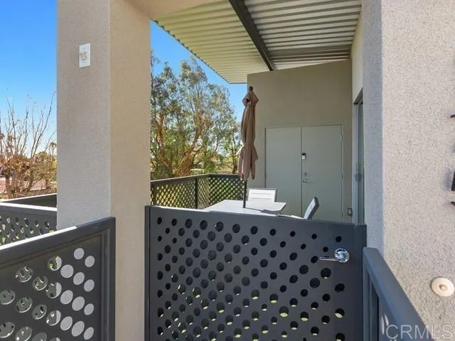 a view of a dining room with a table and chairs