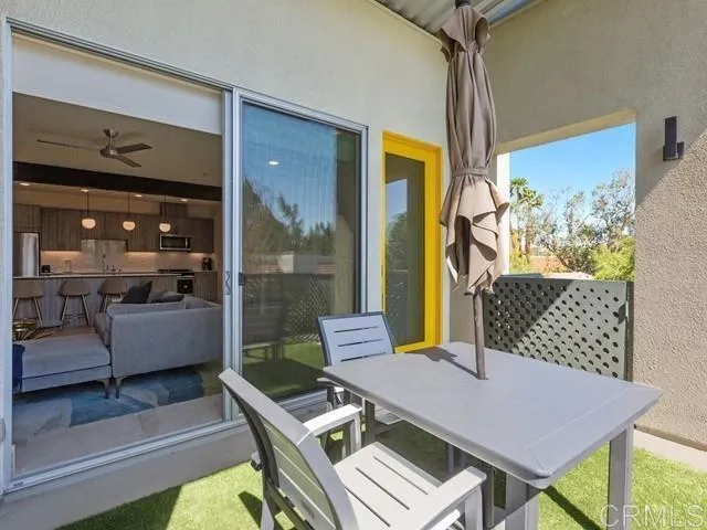 a view of a chairs and table in patio