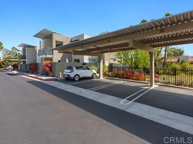 a view of a patio with table and chairs and potted plants