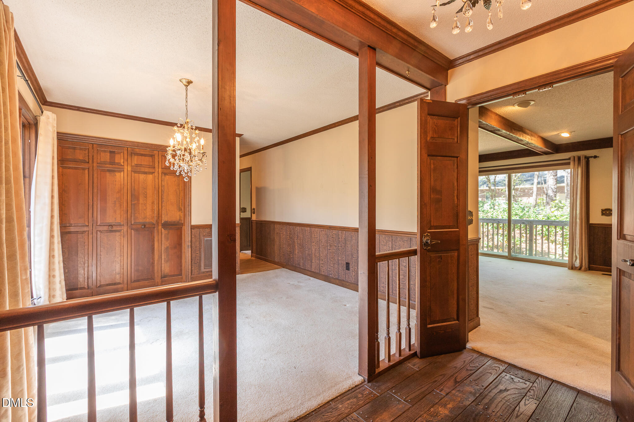 6119 Splitrock Trail Apex, NC 27539 - Photo 11 of 58 an empty room with wooden floor and windows