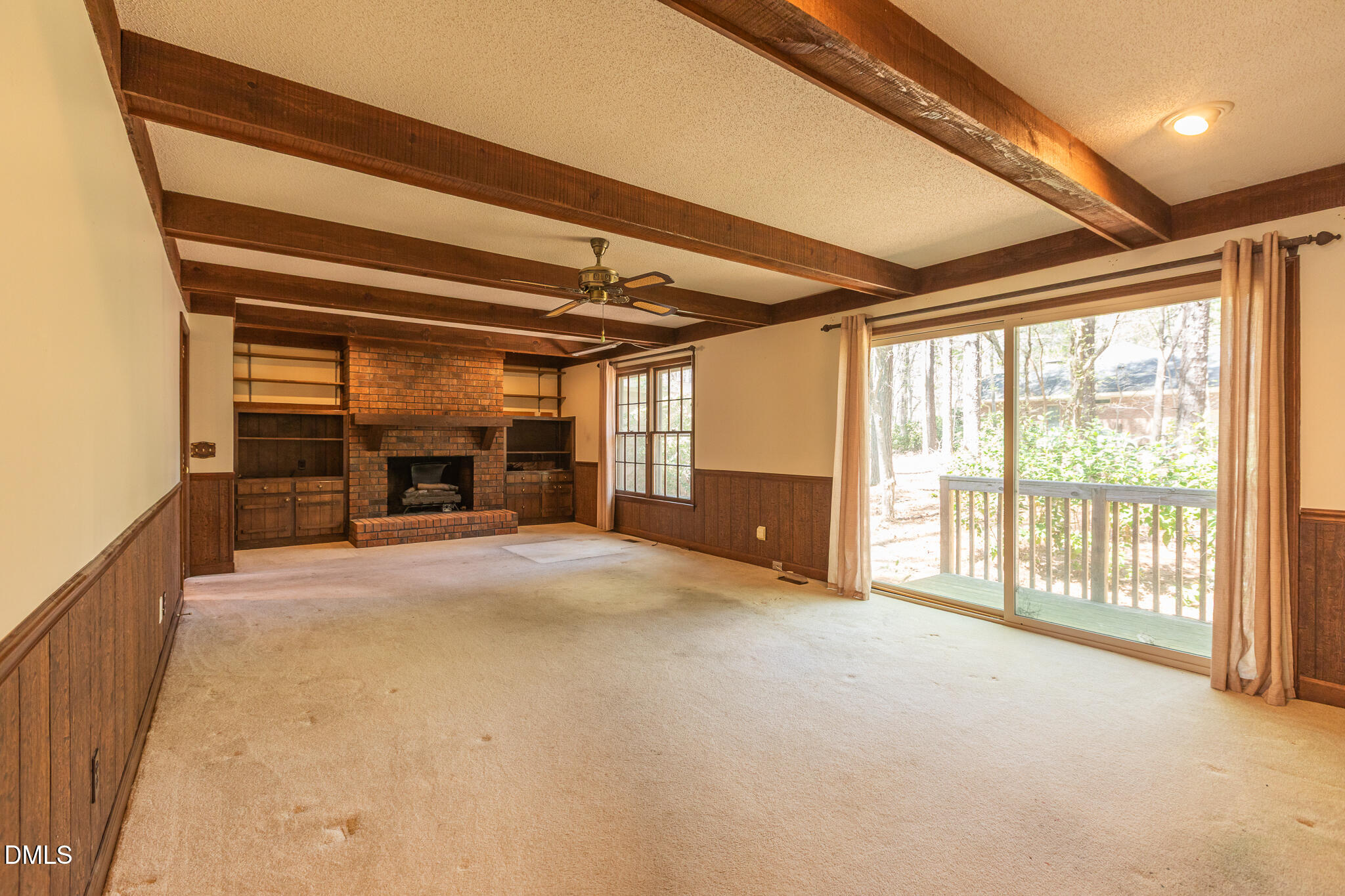 6119 Splitrock Trail Apex, NC 27539 - Photo 13 of 58 a view of an empty room with furniture and a window