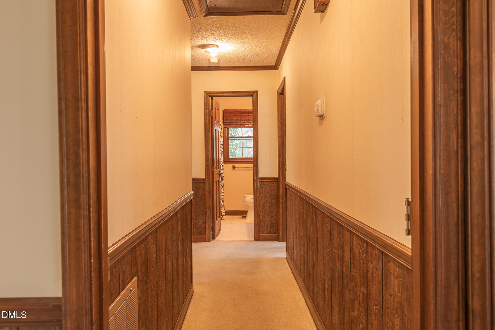 6119 Splitrock Trail Apex, NC 27539 - Photo 18 of 58 a view of a hallway with wooden floor