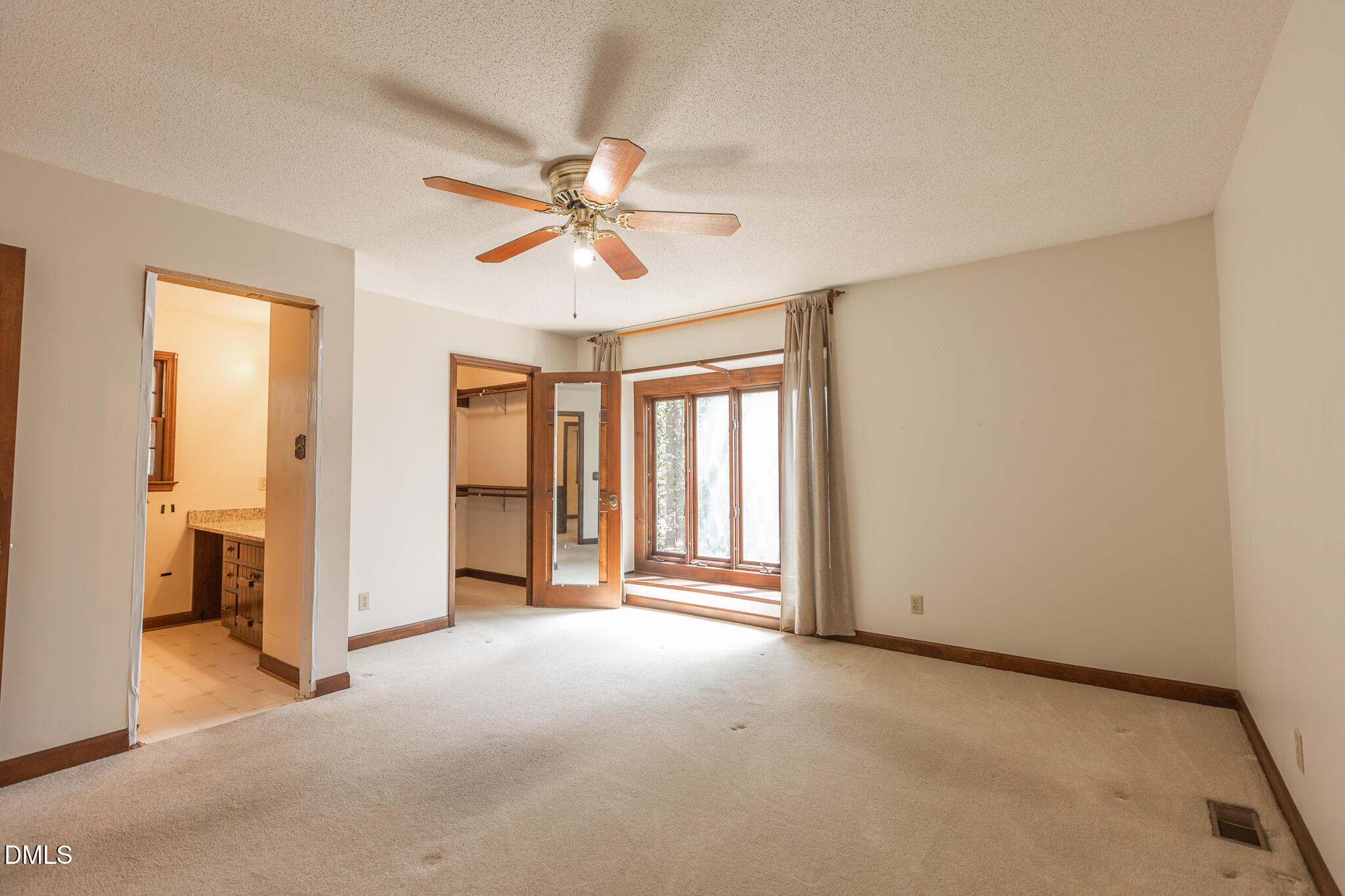 6119 Splitrock Trail Apex, NC 27539 - Photo 19 of 58 a view of a livingroom with a ceiling fan and window
