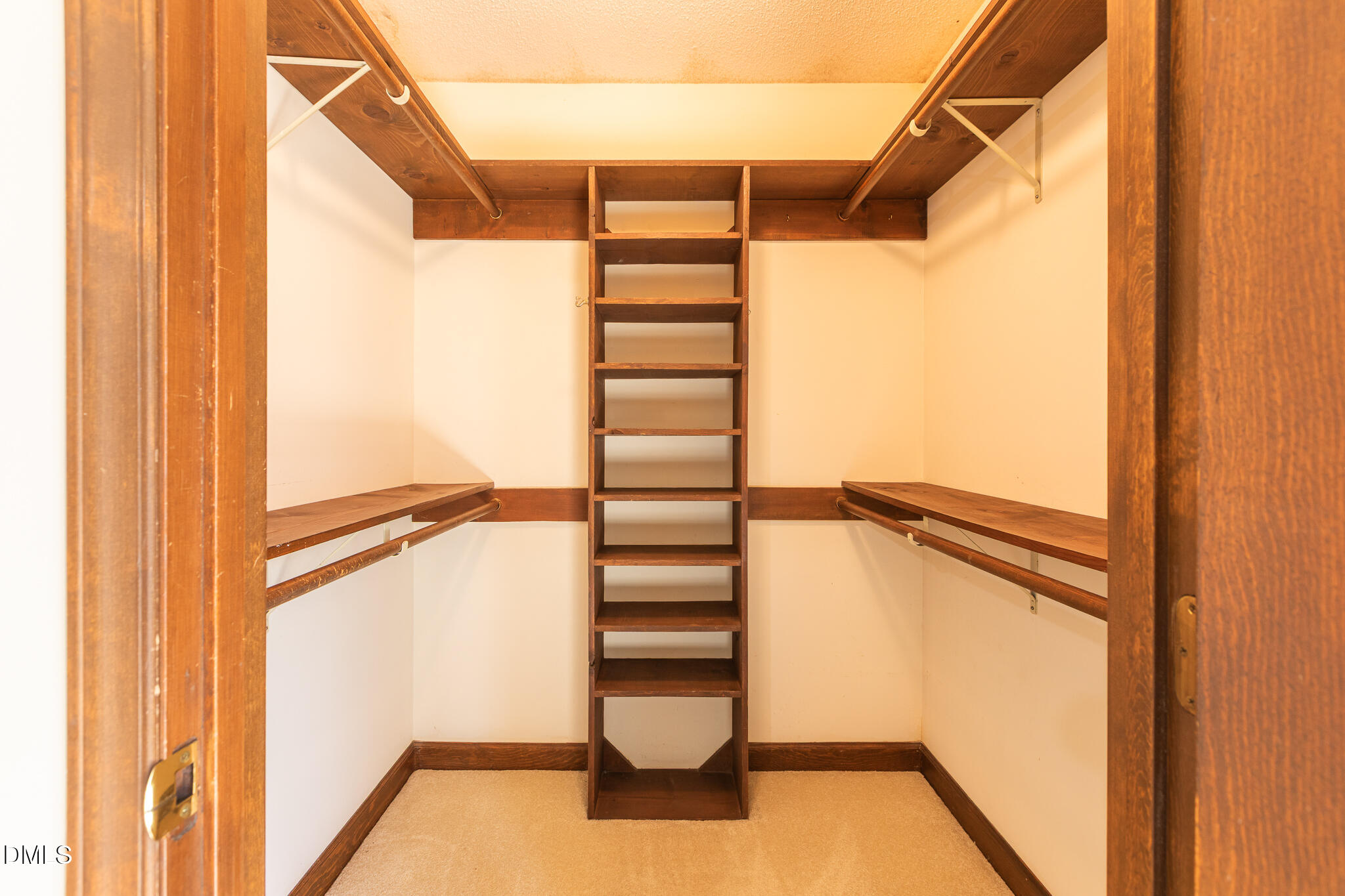 6119 Splitrock Trail Apex, NC 27539 - Photo 20 of 58 a view of walk in closet with empty racks