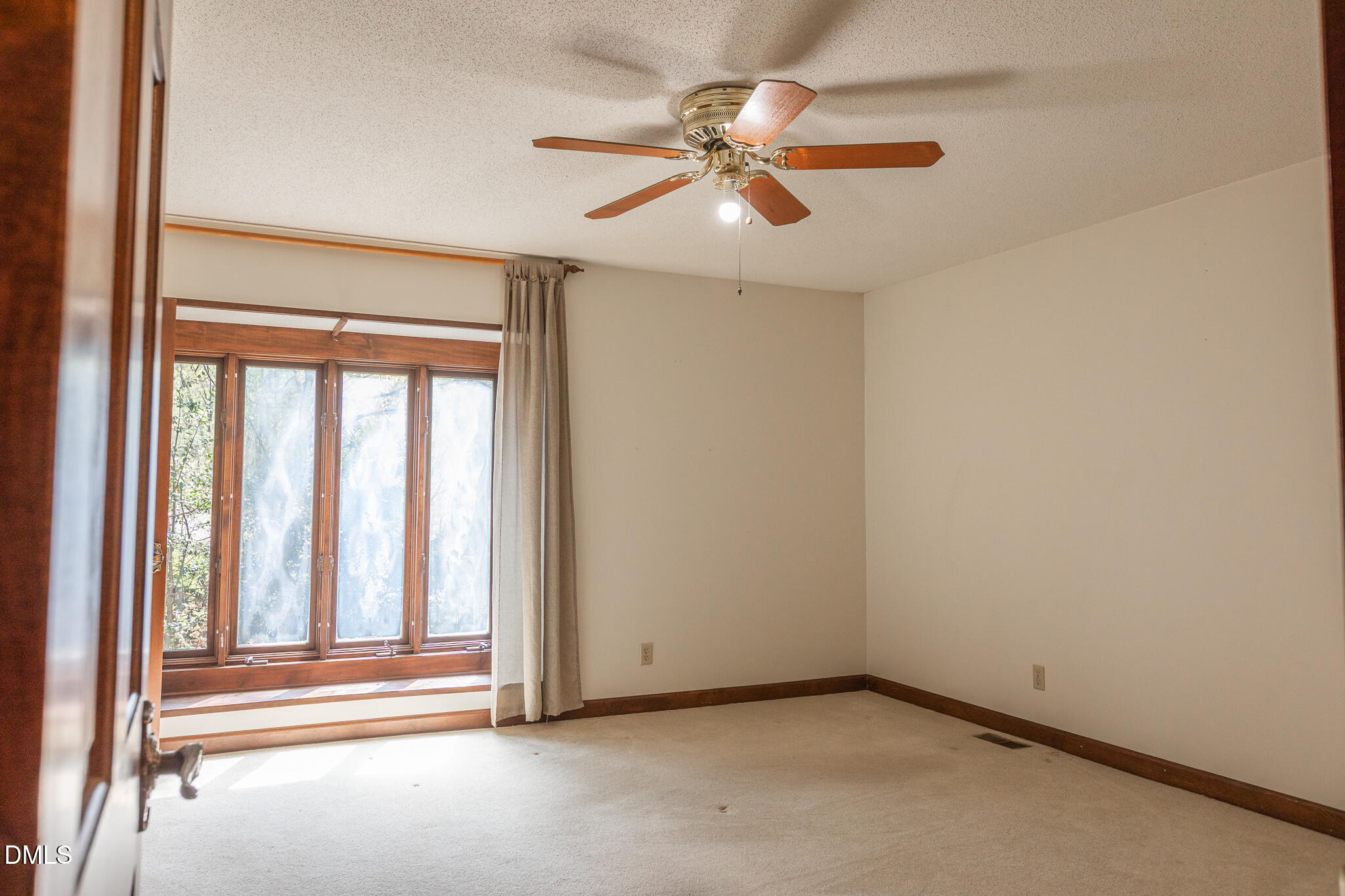 6119 Splitrock Trail Apex, NC 27539 - Photo 21 of 58 an empty room with chandelier fan