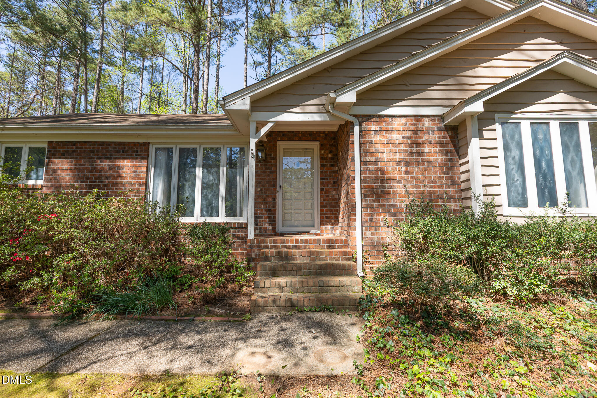 6119 Splitrock Trail Apex, NC 27539 - Photo 7 of 58 a front view of a house with garden