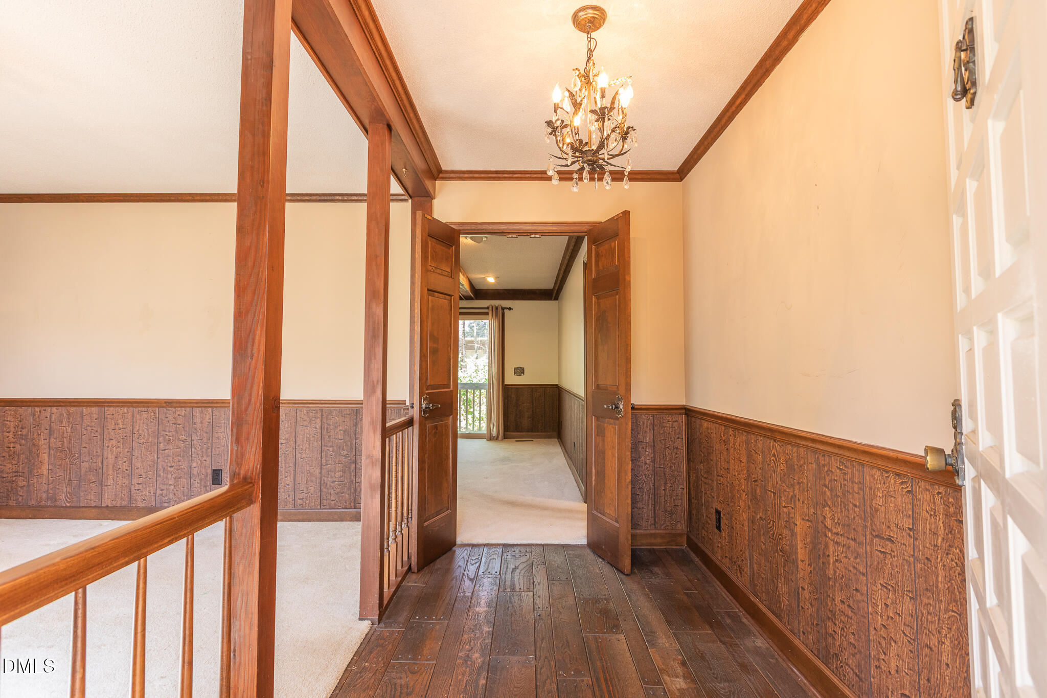 6119 Splitrock Trail Apex, NC 27539 - Photo 10 of 58 a view of a hallway view with wooden floor and staircase