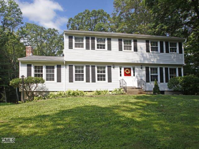 173 Hanover Road Newtown, CT 06470 - Photo 1 of 1 a front view of a house with a garden