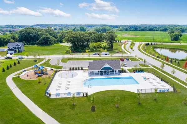 a view of house with outdoor space and swimming pool