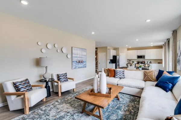 a living room with furniture and a table