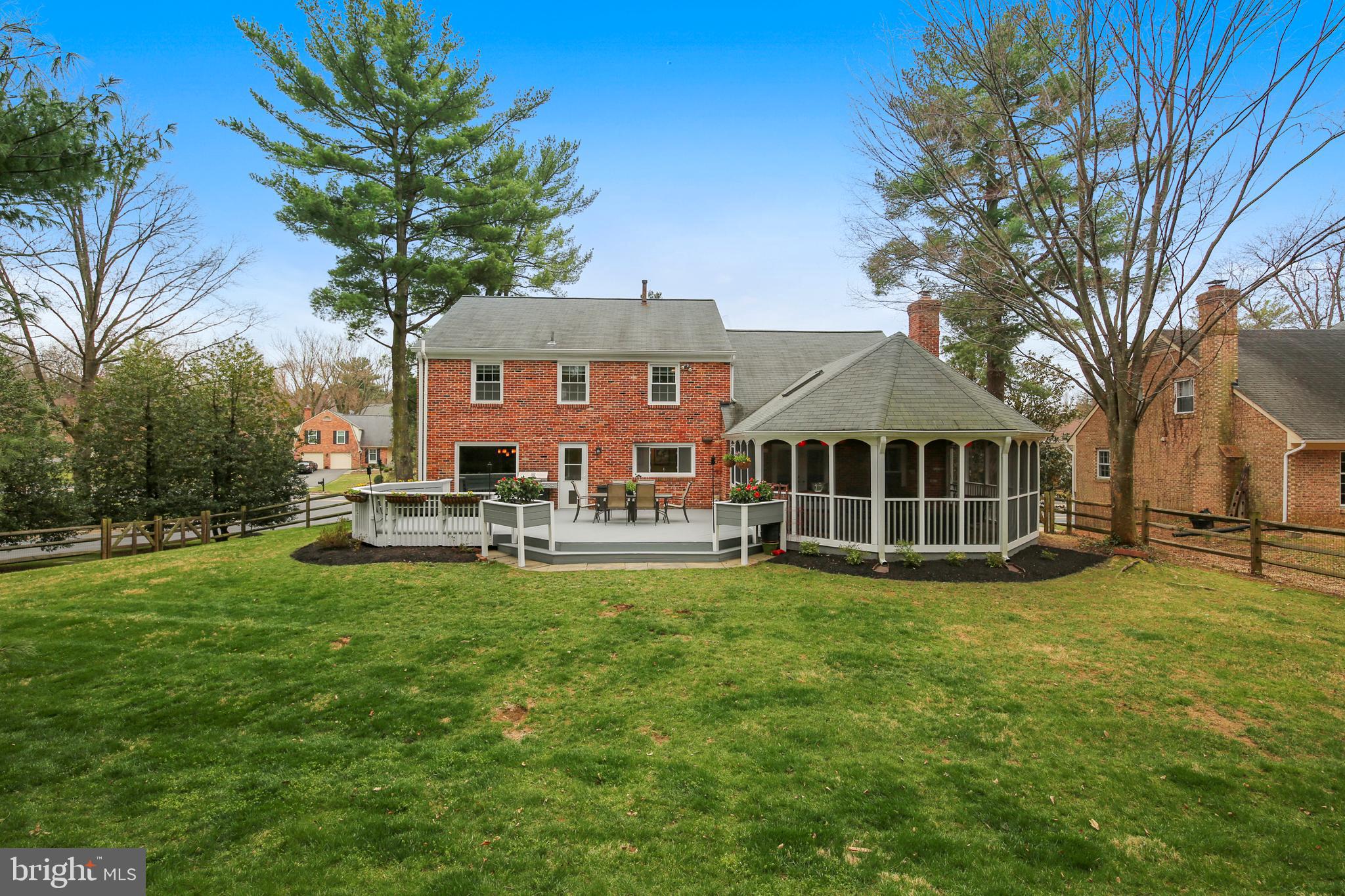 8801 Cold Spring Road Potomac, MD 20854 - Photo 43 of 44 a view of a house with pool and a yard