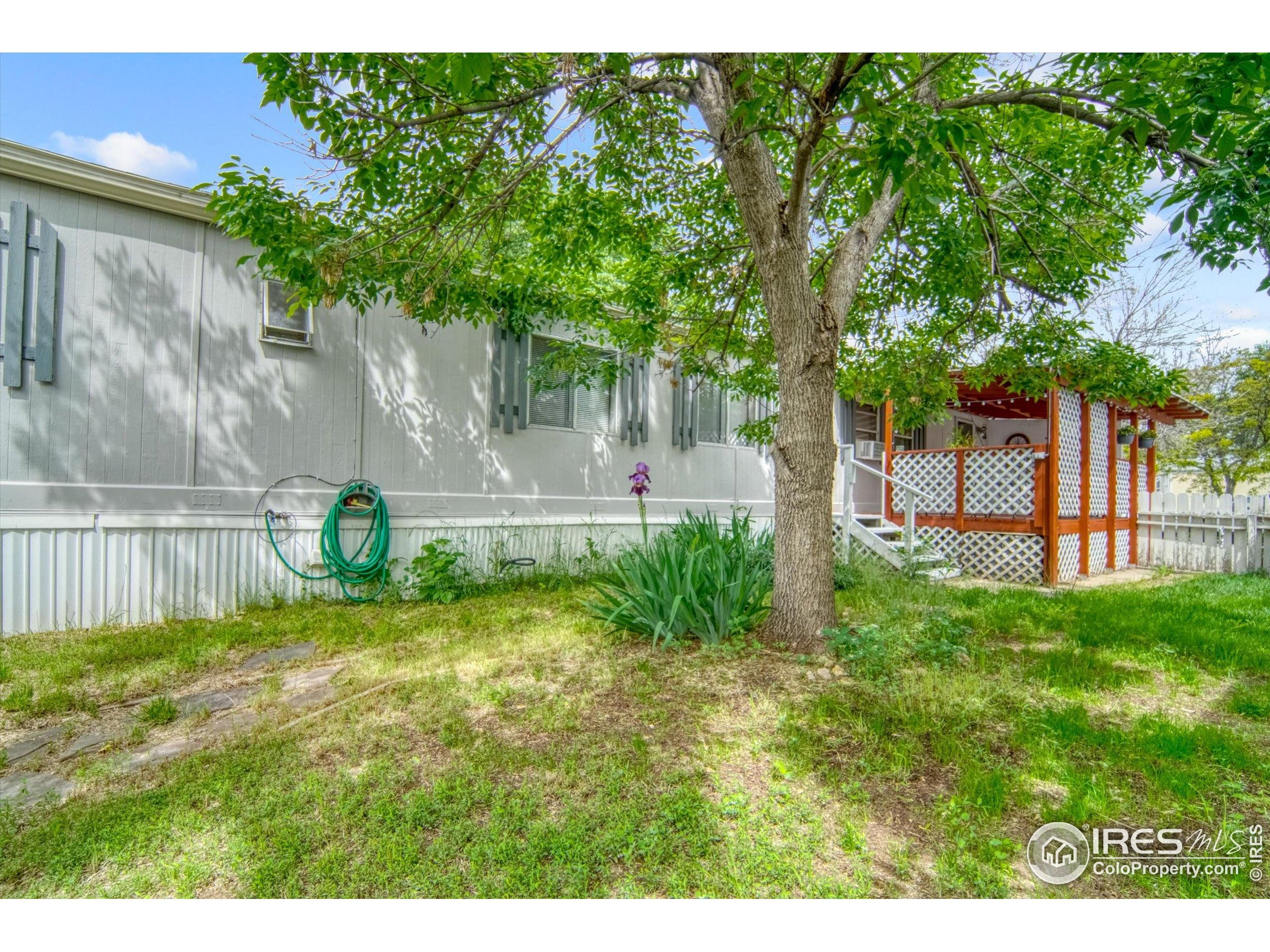 5000 Butte Street, Unit 272 Boulder, CO 80301 - Photo 1 of 21 a view of a backyard with a garden